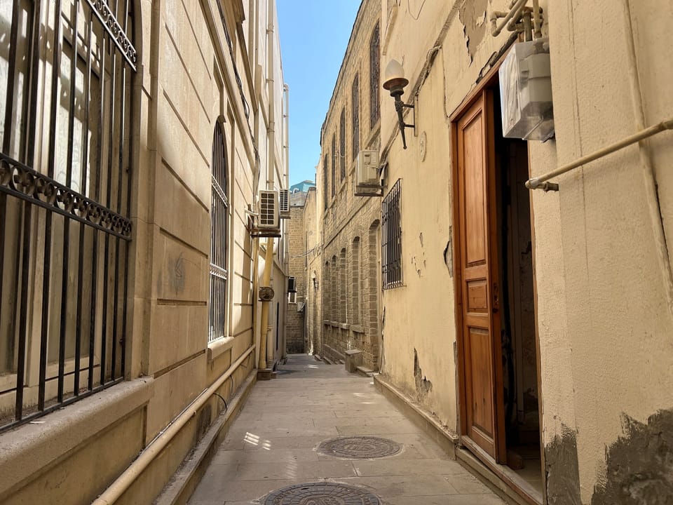 Narrow Old City lane leading to the apartment entrance.
