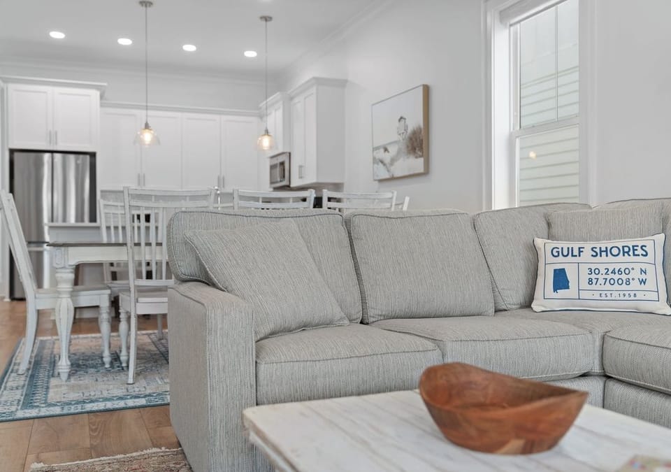 Comfortable seating flows seamlessly into the dining and kitchen areas.
