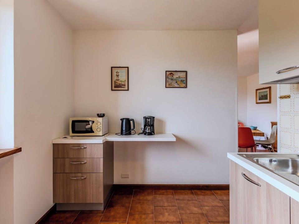 Interior Design, Flooring, Furniture, Wood, Kitchen, Countertop, Floor, Cabinetry, Ceiling, Room