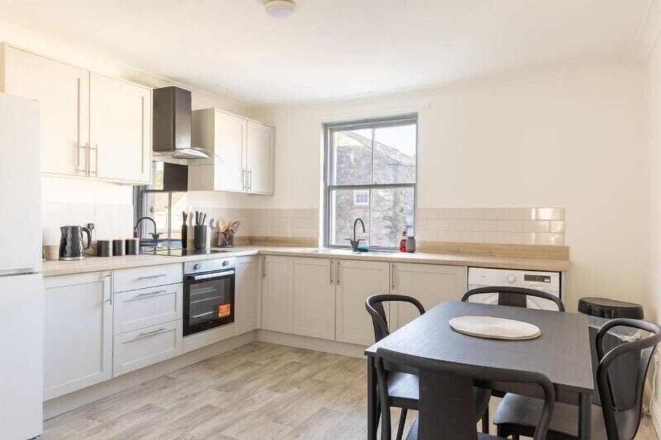 Spacious kitchen area perfect for breakfast.