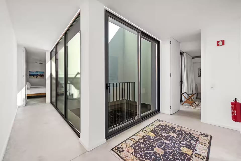 Light-filled gallery corridor connecting the bedroom suites