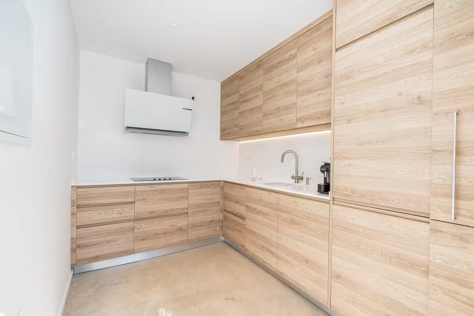 Indoors, this fully equipped kitchen serves the rooftop level.