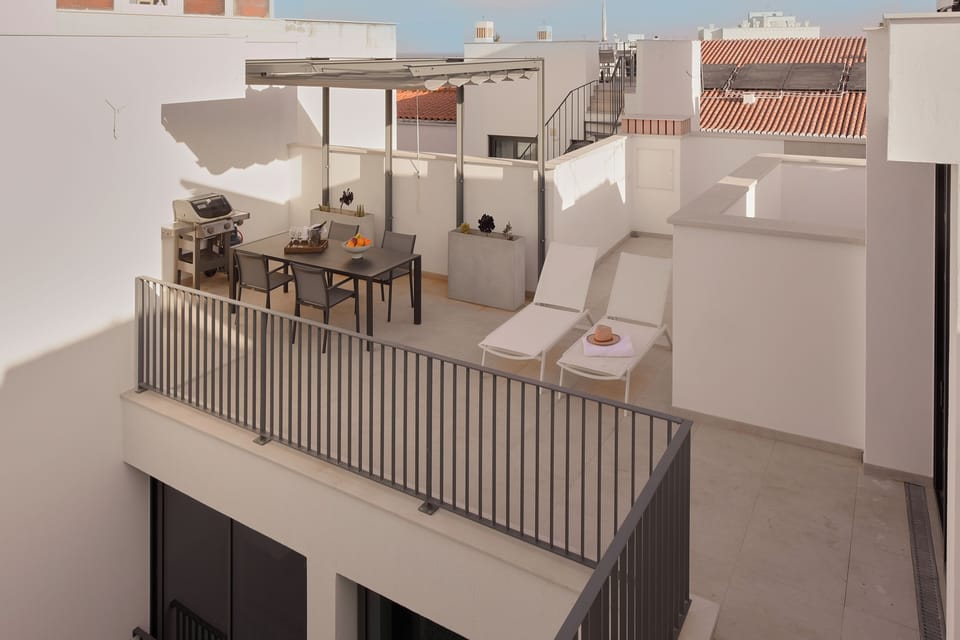 Enjoy long evenings on the rooftop terrace. Perfect for dining and sunbathing, 