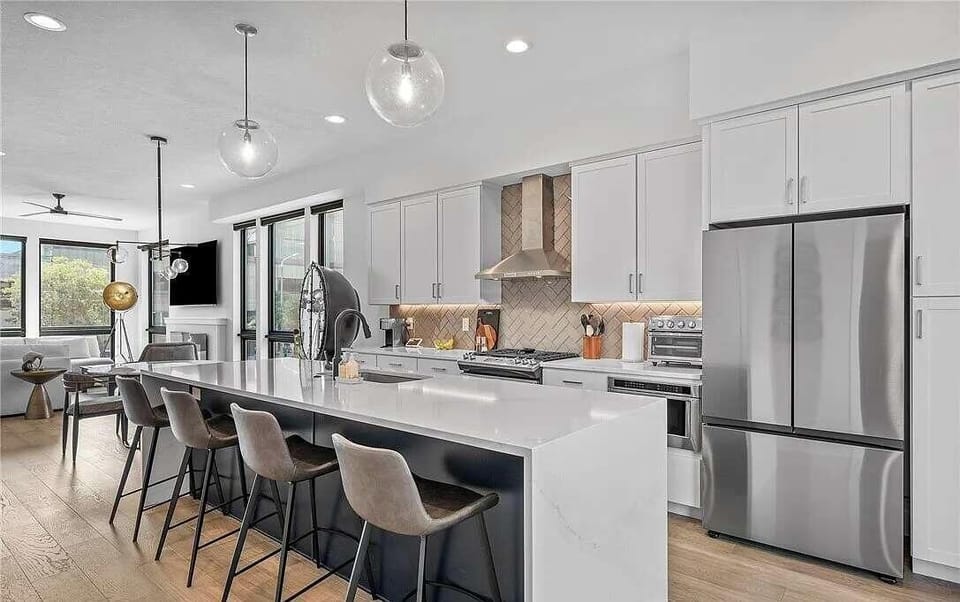 Modern kitchen with a large island and stainless steel appliances