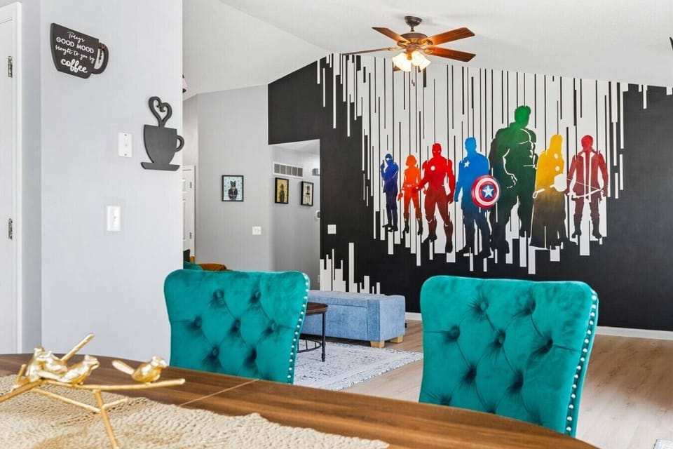 Gather together in the bright, open living room featuring a large sectional, cozy accent seating, and plenty of space for everyone to relax after a day of exploring St. Louis.