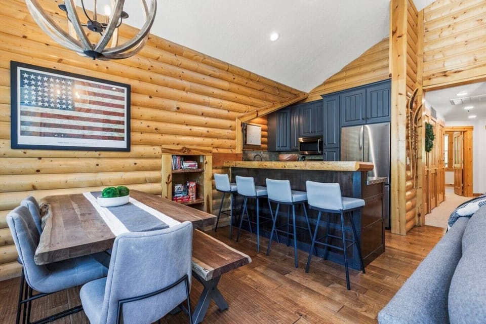 Mountain retreat kitchen equipped for home cooking, featuring full-size appliances and convenient access to the dining and living areas for easy gathering