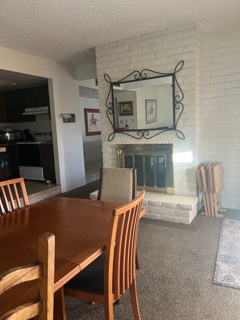 Fireplace (not usable) hearth divides the two living areas. Faces the canal. 