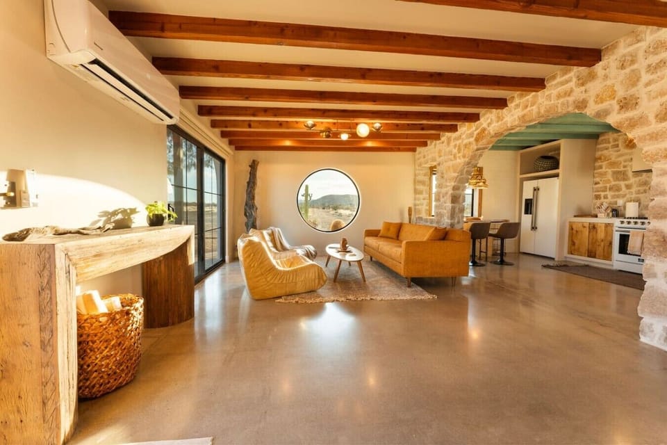 Relax in a bright, open living space with timeless desert-inspired design.