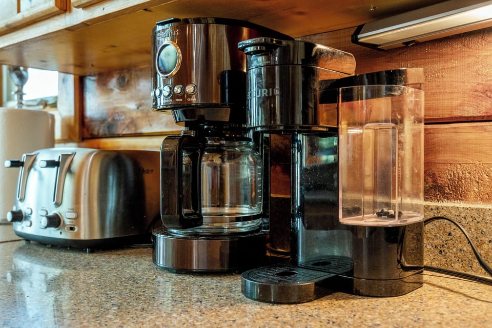 Cozy coffee station with drip brewer, single-serve maker, and toaster