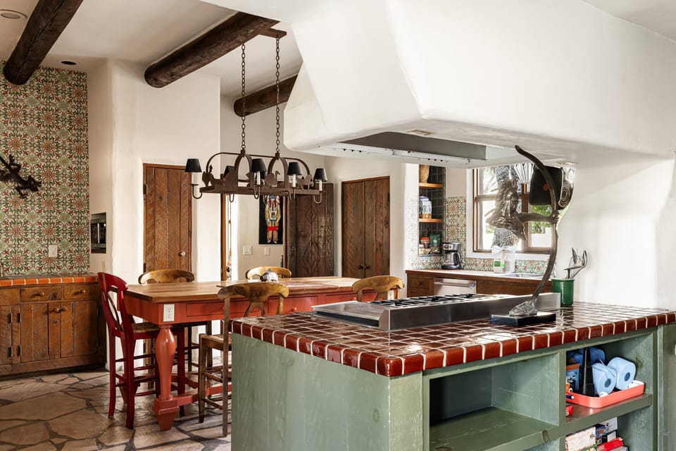 The expansive chef's kitchen features premium appliances, generous prep space, handcrafted finishes, and everything needed for memorable meals.