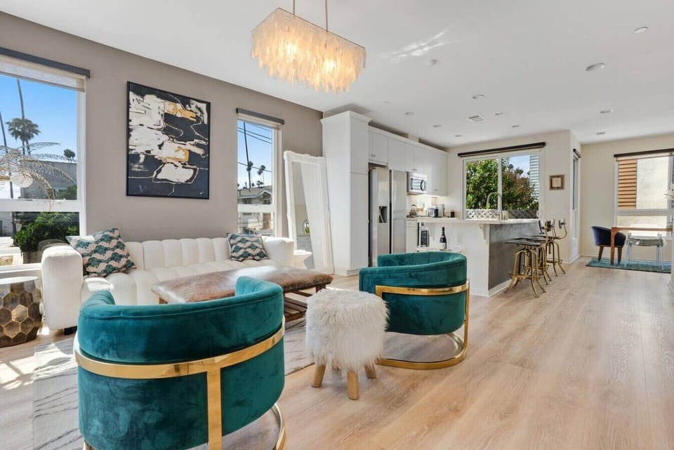 Light-filled living with direct Hollywood Sign views from the private balcony
