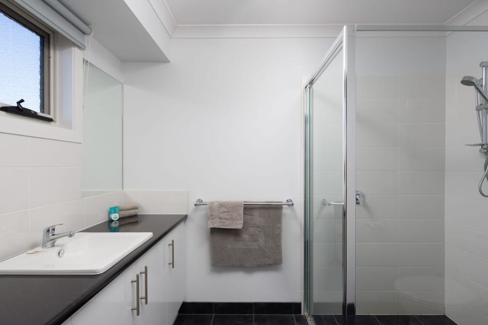 Clean bathroom with a shower and toilet