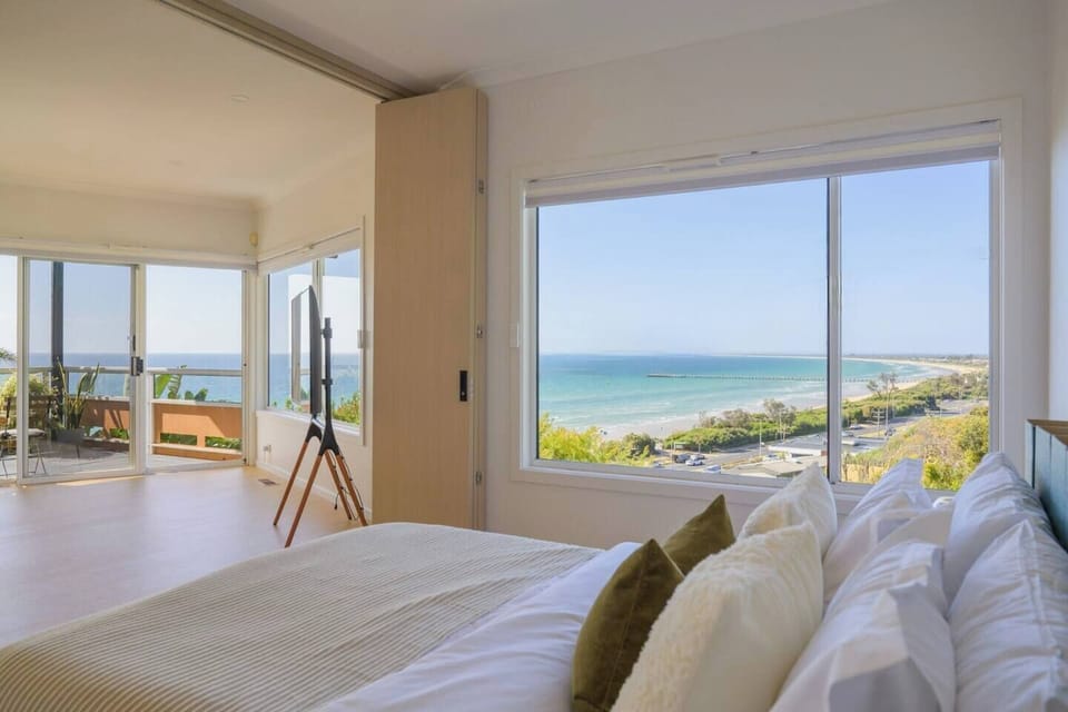 From the bedroom, you can wake up to the breathtaking views of the Pacific Ocean and Philip Bay, all visible right from the comfort of your bed. (The sliding door is decorative and replaced by a curtain)

REVIEW
"The views are to die for."
KATE 