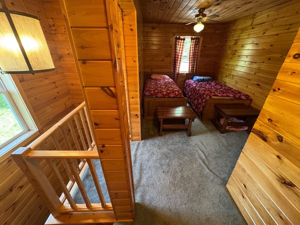 Loft sleeping area with 2 twins.