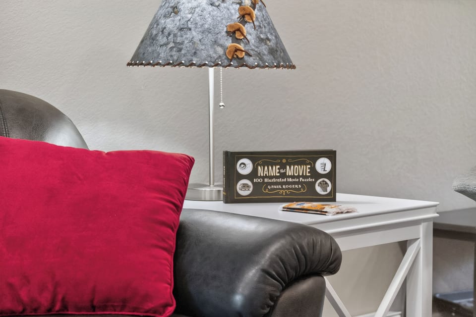 Settle into your cozy seating nook with a movie puzzle and soft lamp light—your perfect spot to unwind and relax after exploring the area.