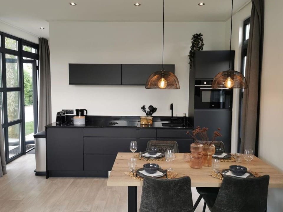 Kitchen, Countertop, Interior Design, Furniture, Light Fixture, Flooring, Ceiling, Lighting, Kitchen Appliance, Cabinetry