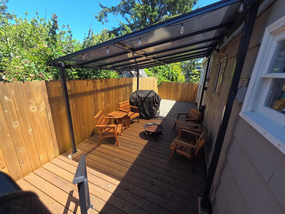 Outdoor Living – Unwind on the spacious covered patio with cozy seating and a grill.
