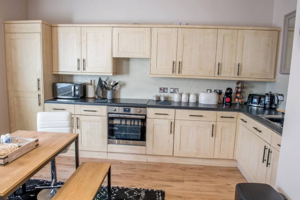Kitchen with oven and microwave