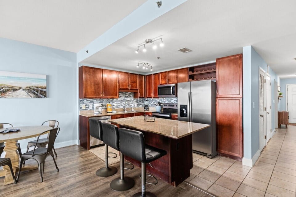 Fully Stocked Kitchen with Stainless Steel Appliances, Island Bar Seating and Drip Coffee Maker