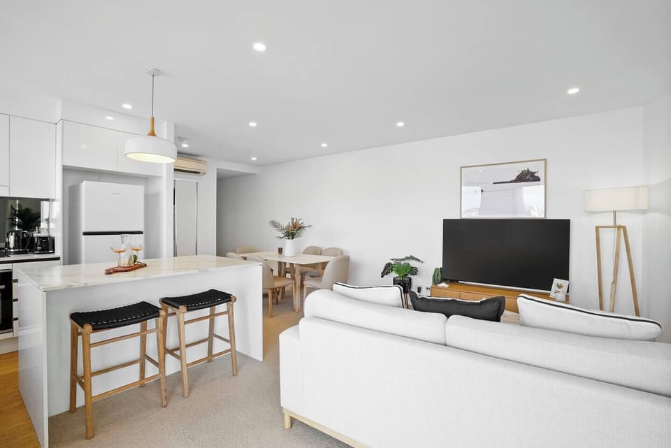 Enjoy the open-plan living area, where the kitchen, dining and lounge come together in a bright, welcoming space designed for easy holiday living.