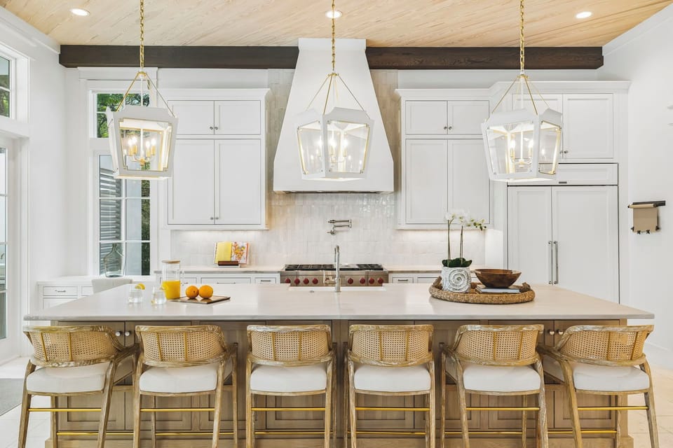 Step into a light-filled kitchen where rustic wood beams meet modern elegance. Gather around the spacious island, perfect for morning coffee or evening meals, with designer fixtures illuminating your every moment.