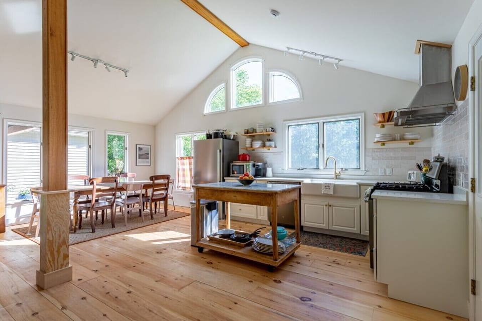Gather around the dining table while the chef enjoys the open kitchen with a spacious prep island