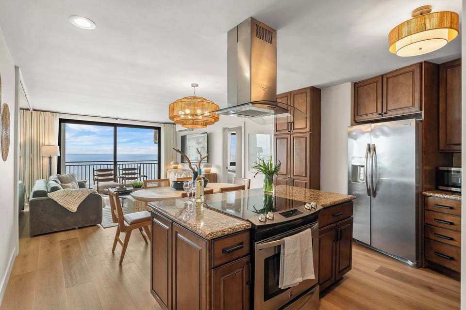 The home features a fully stocked kitchen with stainless steel appliances. 