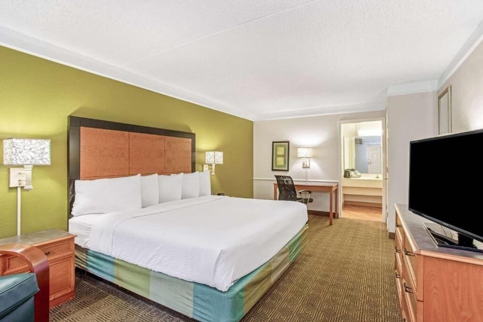 Unwind in a bright king room with crisp linens.