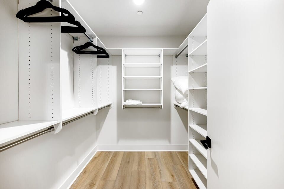 A generous walk-in closet with plenty of shelving and hanging space to unpack and settle in.