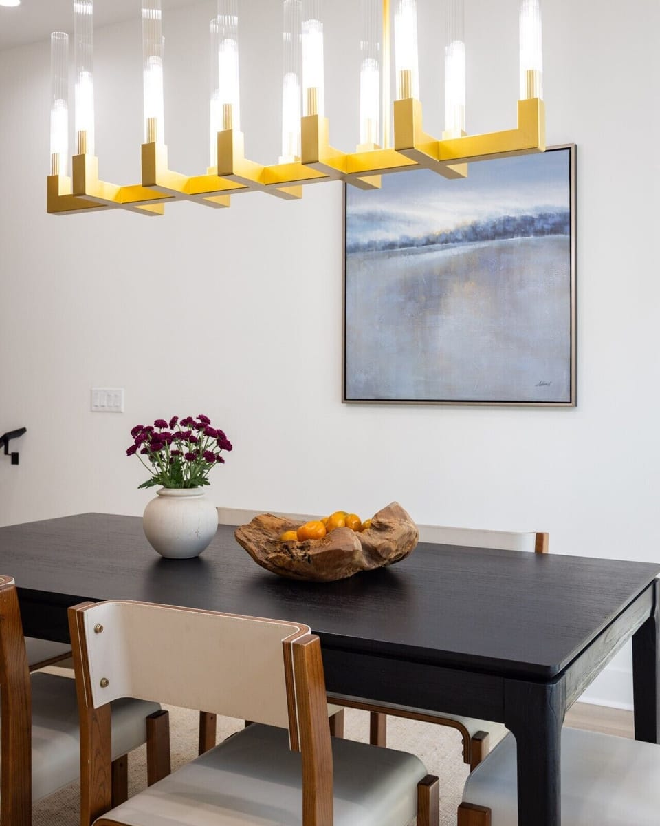 A simple, elegant touch to the dining space with fresh flowers and a curated centerpiece.