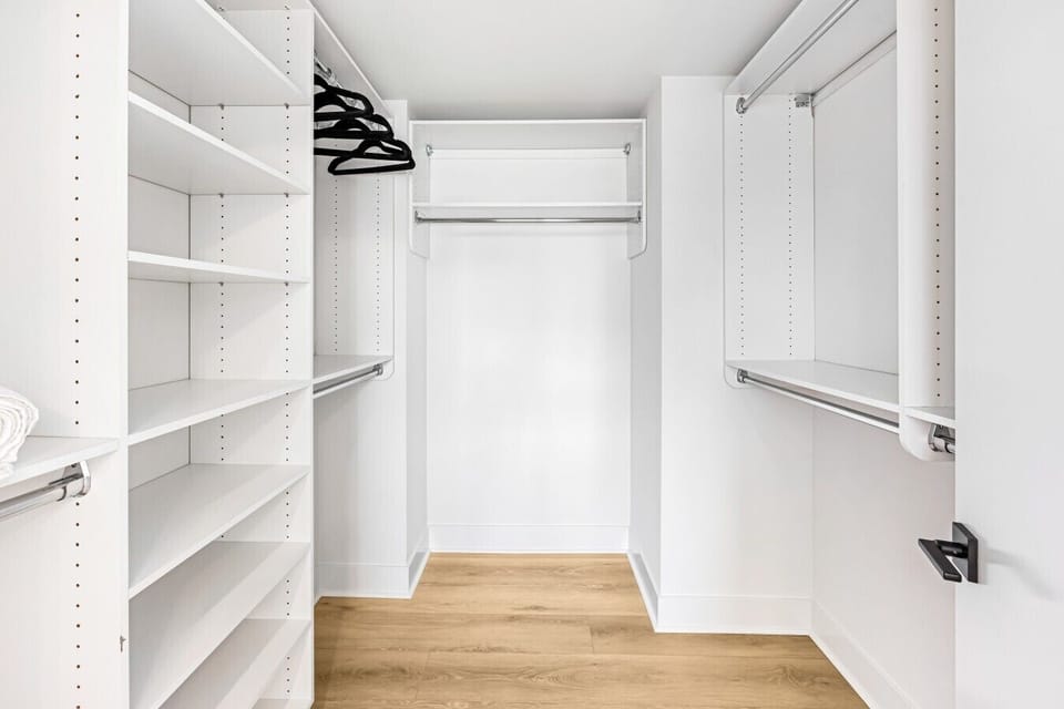 Spacious walk-in style closet with plenty of shelving and hanging space to fully unpack and settle in.