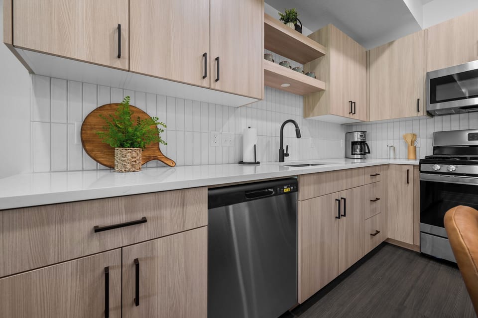 Modern kitchen featuring stainless steel appliances and generous workspace.