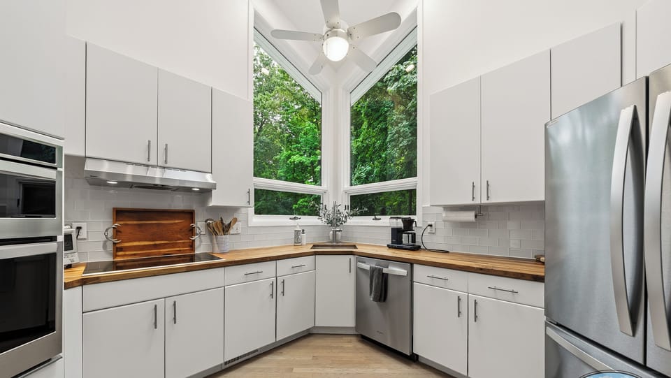 Fully equipped kitchen with dishwasher, large refrigerator  and electric stove