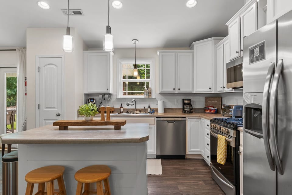 Kitchen fully equipped with a coffee machine and Keurig, complemented by thoughtfully curated snacks, quality utensils, paper towels, and essential cleaning supplies. Designed to offer a seamless, elevated, and comfortable stay