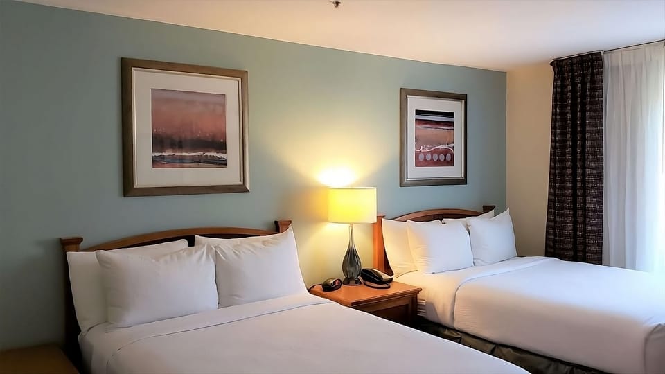 Unwind in crisp linens with two cozy beds.