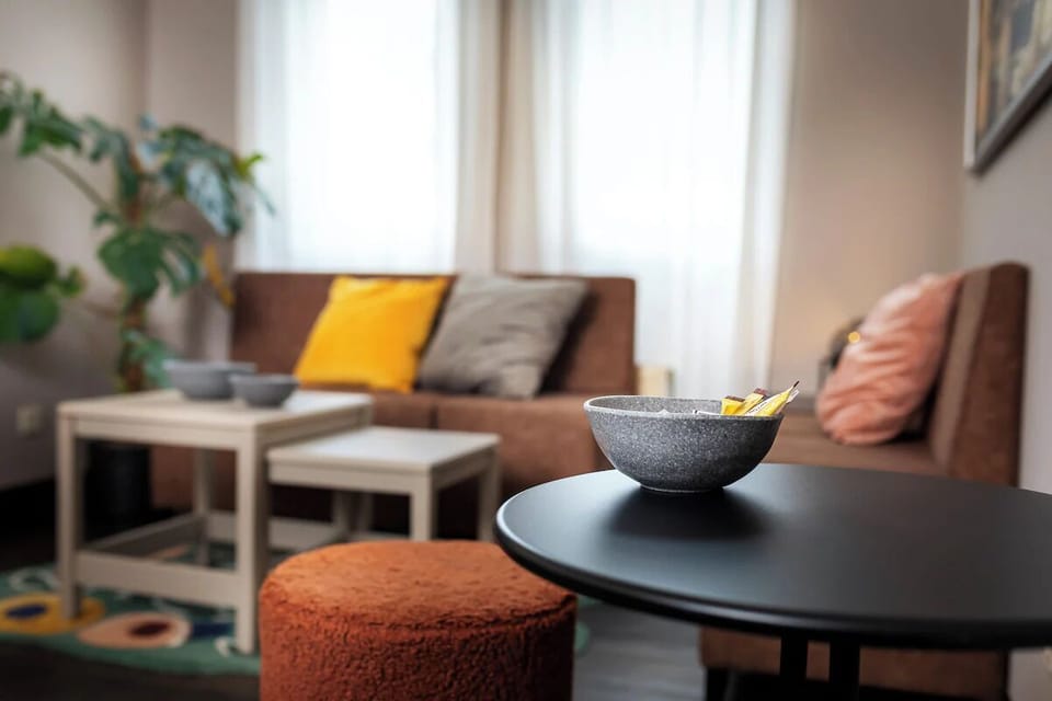 Feel at home with snacks and soft seating by the window.