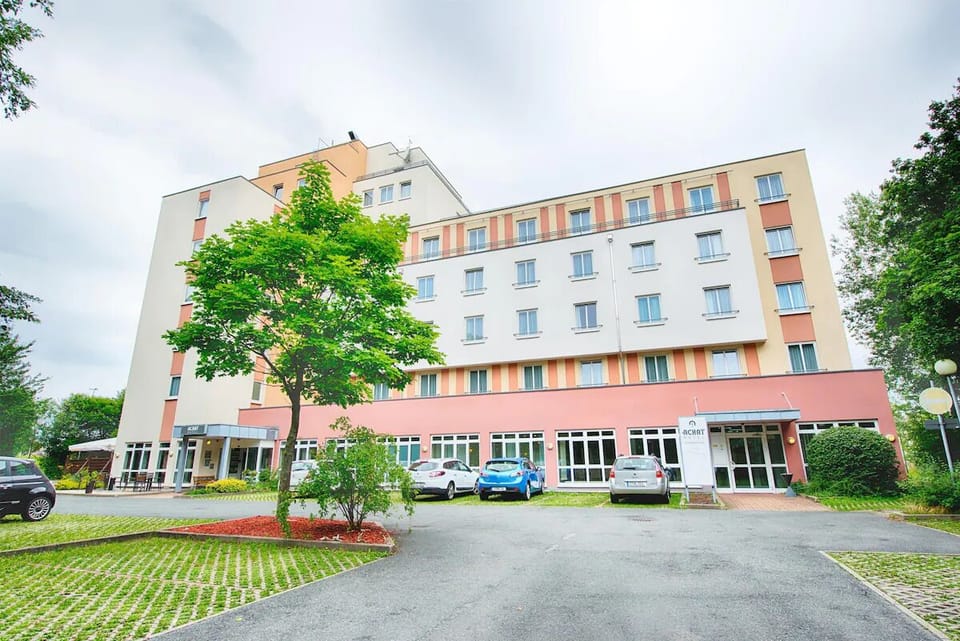 Arrive with ease at a bright, modern hotel exterior.
