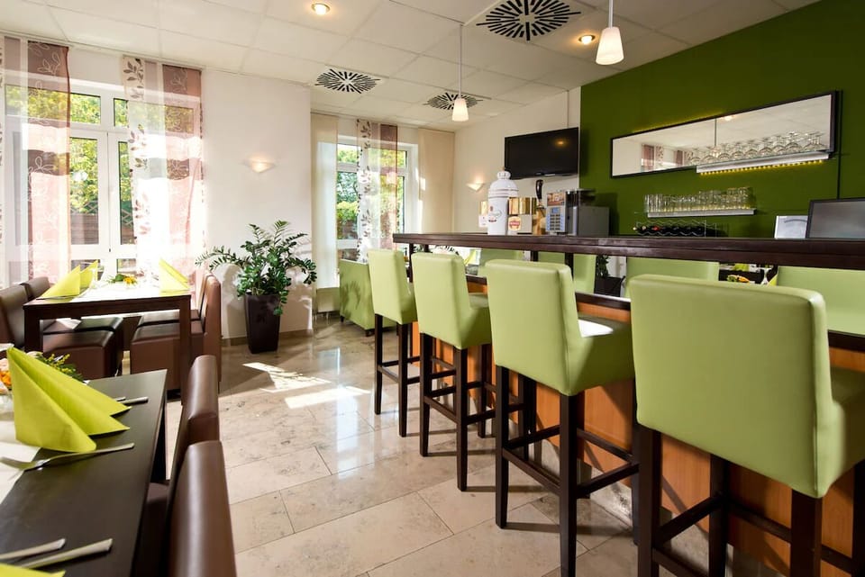 Relax by the bar as daylight streams through tall windows.