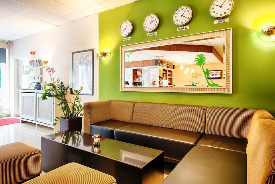 Unwind on cozy sofas in a bright, welcoming lounge.