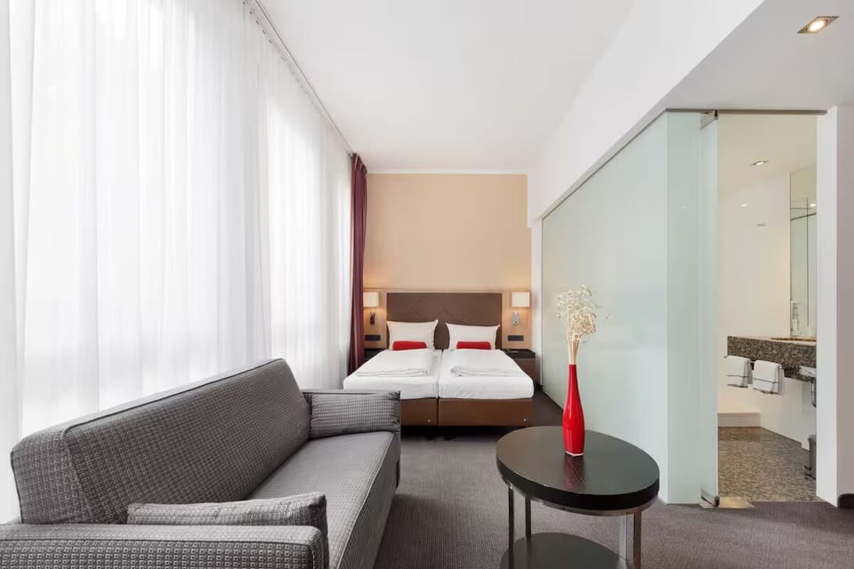 Unwind on the sofa, then sink into crisp twin beds.