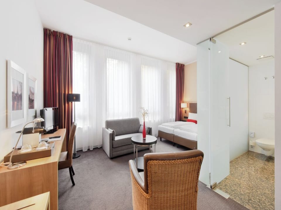Stretch out in an airy suite with lounge space and desk.