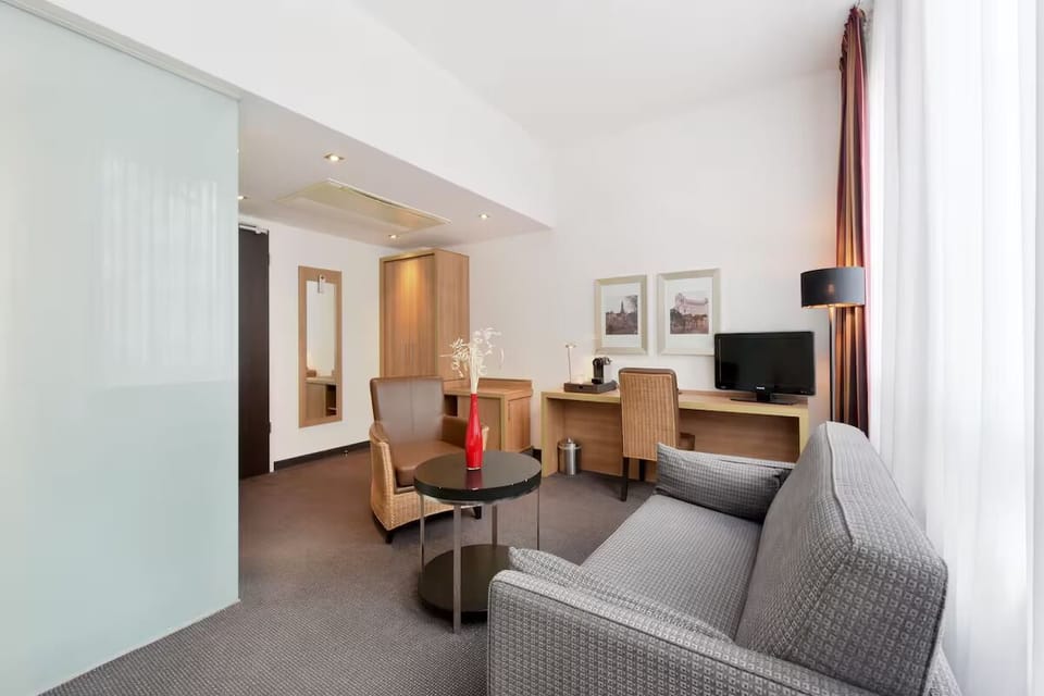 Settle in with a dedicated desk and cozy seating area.