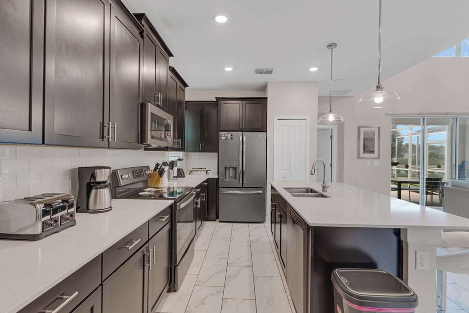 Everything you need for easy vacation meals, from full-size appliances to generous counter space and a breakfast island.