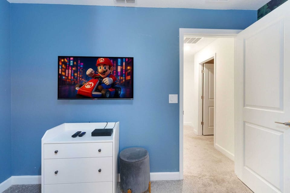 Wind down with your favorite shows in a fun, colorful bedroom made for relaxing after the parks.