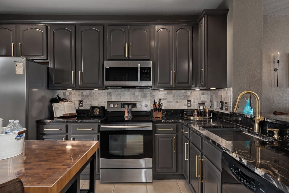 Whip up a feast before your next adventure ✨ This fully equipped kitchen has stainless steel appliances, generous prep space, and all the essentials for meals big or small