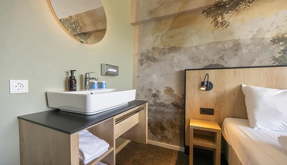Freshen up easily with a convenient in-room washbasin.