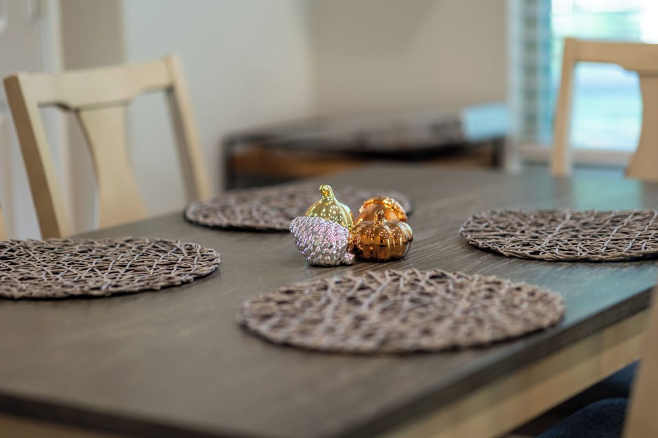 Cozy dining space with stylish table setting and warm, inviting touches