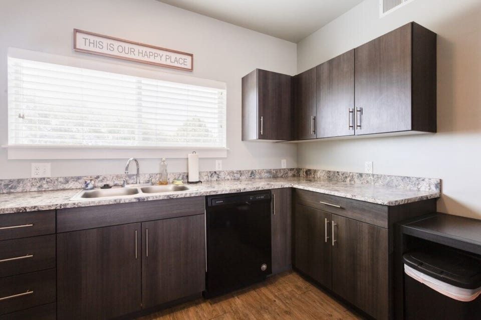 Full kitchen featuring all essential appliances, cookware, utensils, dishes, and cutlery.
