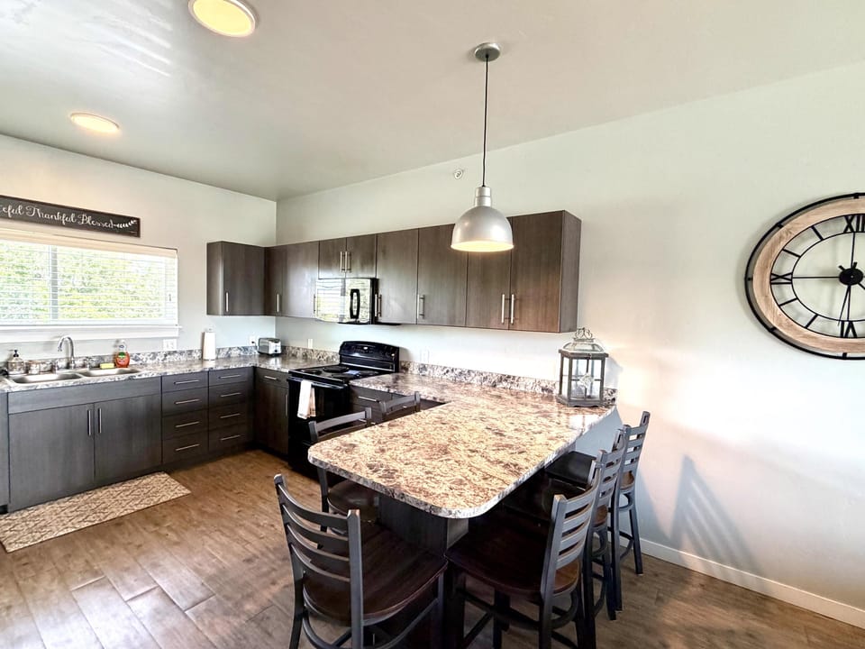 Full kitchen featuring all essential appliances, cookware, utensils, dishes, and cutlery.