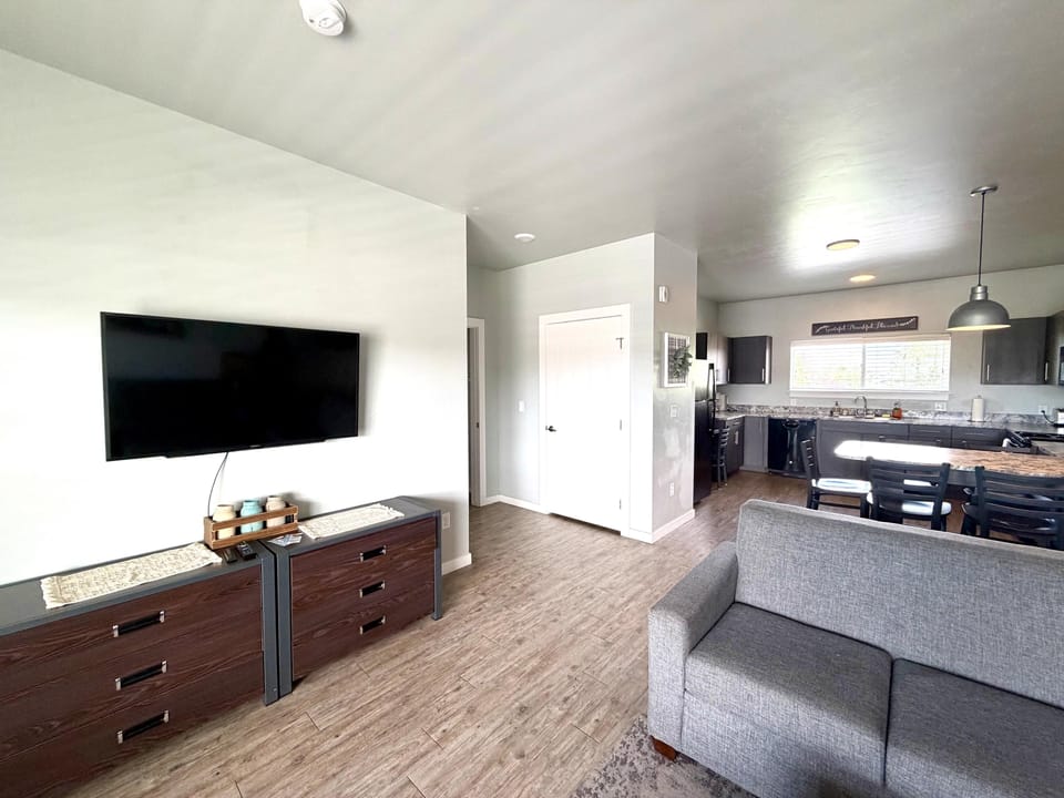 Spacious living room with a TV, offering a comfortable place to gather, relax, and enjoy some downtime.